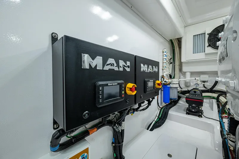  Yacht Photos Pics Engine room of 2023 Viking 54 Open yacht with MAN control panels.