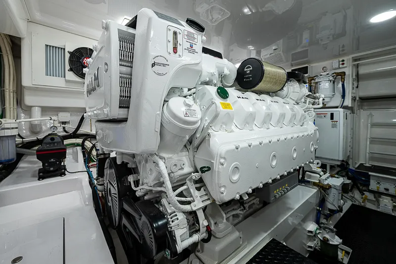  Yacht Photos Pics Engine room of 2023 Viking 54 Open yacht, featuring a powerful marine engine.
