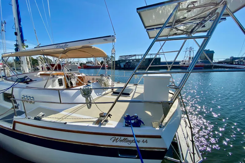 Wonder Yacht Photos Pics Sailboat Wellington 44, 1980 model, docked in sunny marina with clear blue skies.