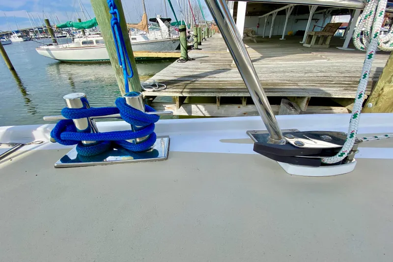 Wonder Yacht Photos Pics Sailboat deck with blue rope and cleat, Wellington 44, 1980 model, docked at marina.