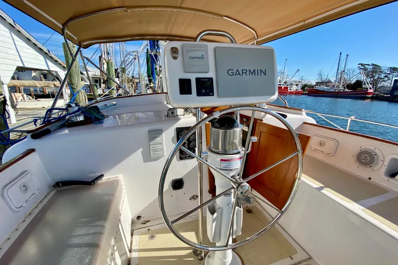 Wonder Yacht Photos Pics Cockpit of 1980 Wellington 44 sailboat with Garmin navigation system, docked at marina.