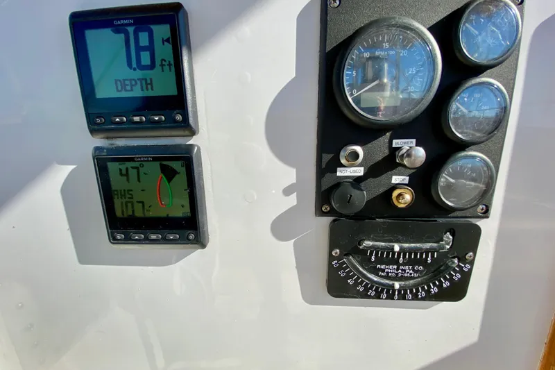 Wonder Yacht Photos Pics Control panel of a 1980 Wellington 44 boat with depth and angle gauges.