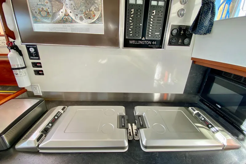 Wonder Yacht Photos Pics Control panel and appliances in a 1980 Wellington 44 yacht interior.