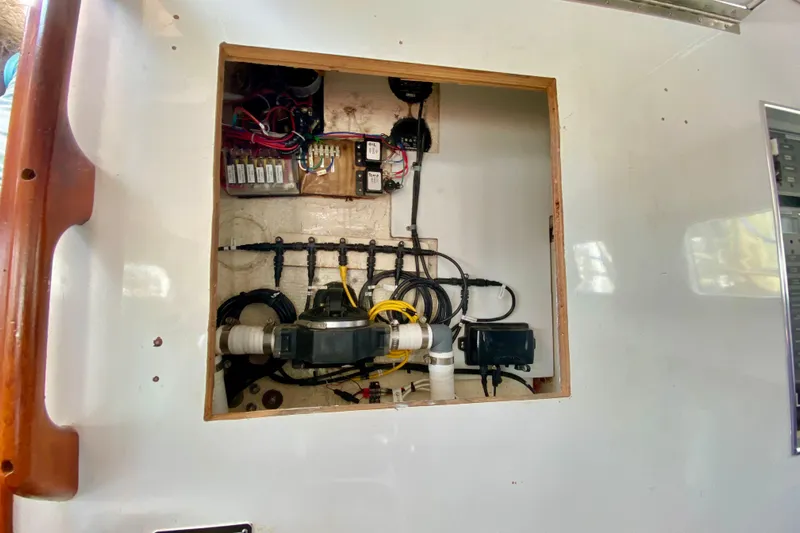 Wonder Yacht Photos Pics Electrical panel inside a 1980 Wellington 44 boat, showcasing wiring and components.
