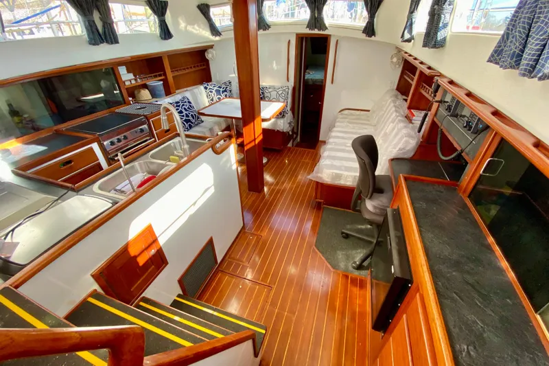 Wonder Yacht Photos Pics Interior of 1980 Wellington 44 yacht with wood flooring and modern amenities.