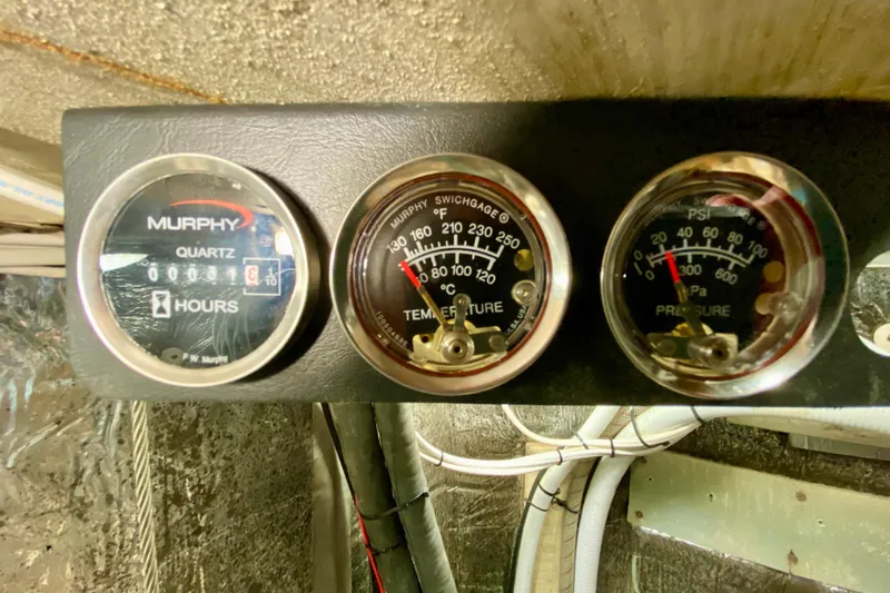 Wonder Yacht Photos Pics Vintage Wellington 44 engine gauges from 1980, displaying hours, temperature, and pressure readings.