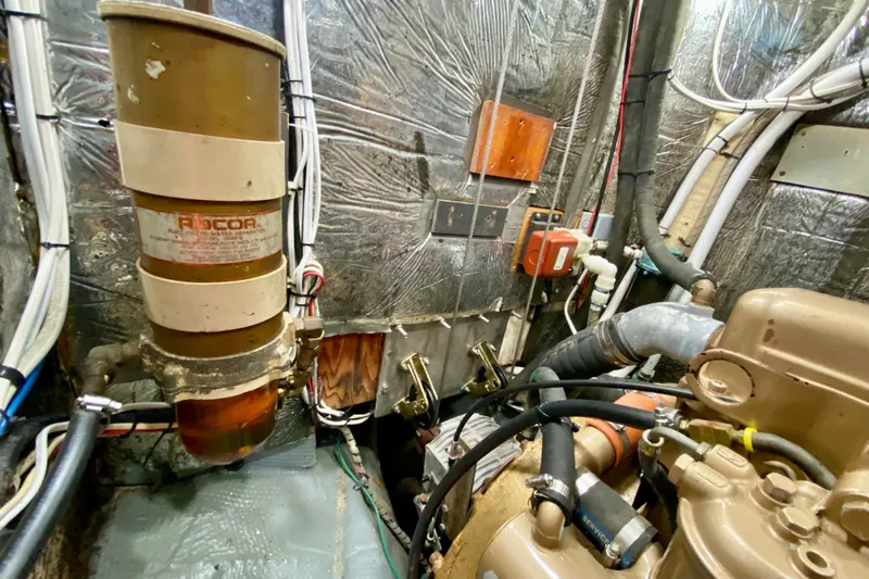 Wonder Yacht Photos Pics Engine room of 1980 Wellington 44 with Racor fuel filter and various mechanical components.