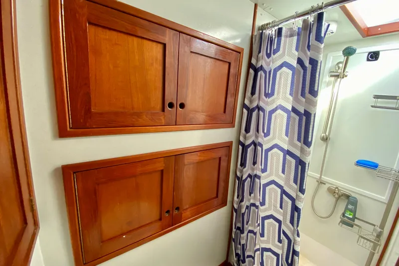 Wonder Yacht Photos Pics Wooden cabinets and geometric shower curtain in 1980 Wellington 44 bathroom.