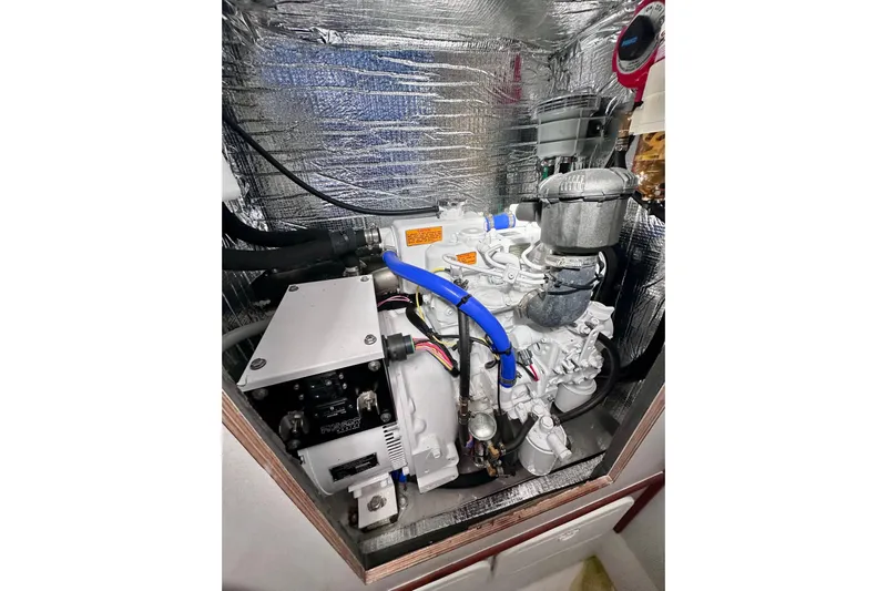 Wonder Yacht Photos Pics Engine compartment of a 1980 Wellington 44, featuring insulated walls and visible components.