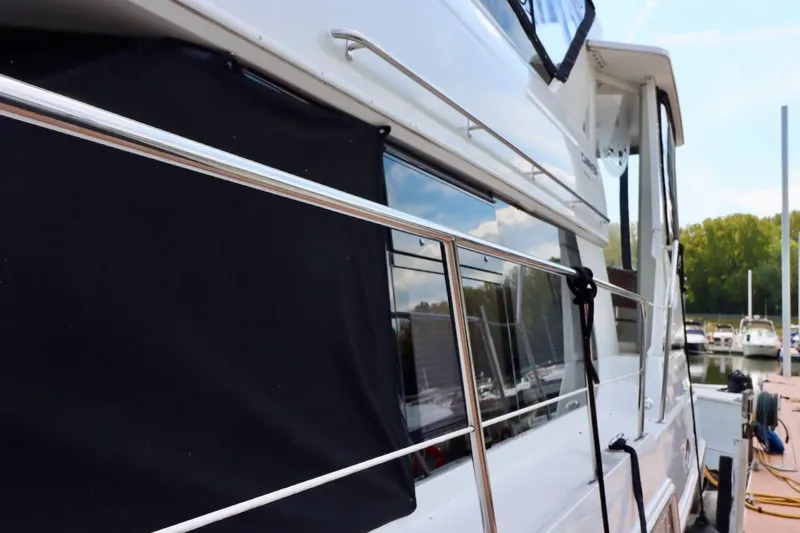 Grace Wins II Yacht Photos Pics 2001 Carver 406 Motor Yacht docked, featuring sleek design and polished railings.