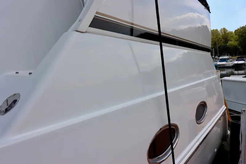 Grace Wins II Yacht Photos Pics 2001 Carver 406 Motor Yacht side view, docked with visible portholes and sleek design.