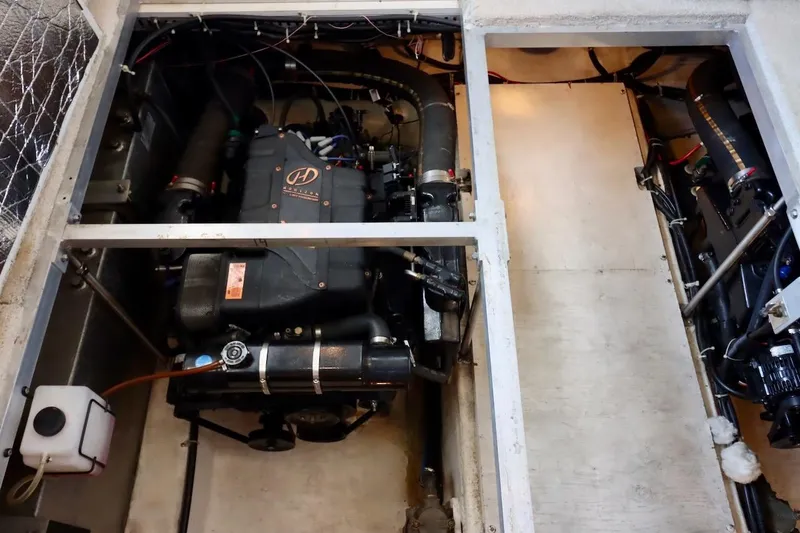 Grace Wins II Yacht Photos Pics Engine room of a 2001 Carver 406 Motor Yacht, showcasing mechanical components.