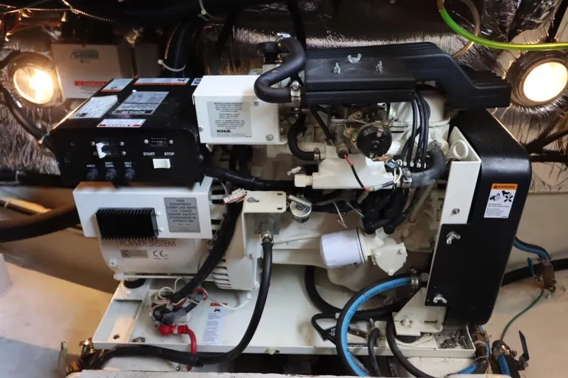 Grace Wins II Yacht Photos Pics Engine room of a 2001 Carver 406 Motor Yacht, featuring mechanical components and wiring.