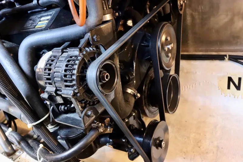 Grace Wins II Yacht Photos Pics Engine components of a 2001 Carver 406 Motor Yacht, featuring belts and pulleys.