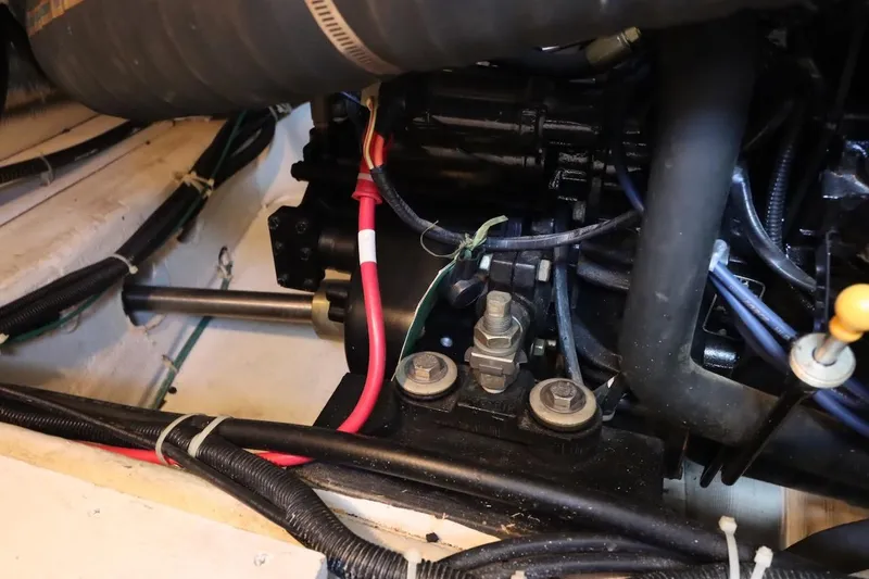 Grace Wins II Yacht Photos Pics Engine compartment of a 2001 Carver 406 Motor Yacht, showing wiring and mechanical components.