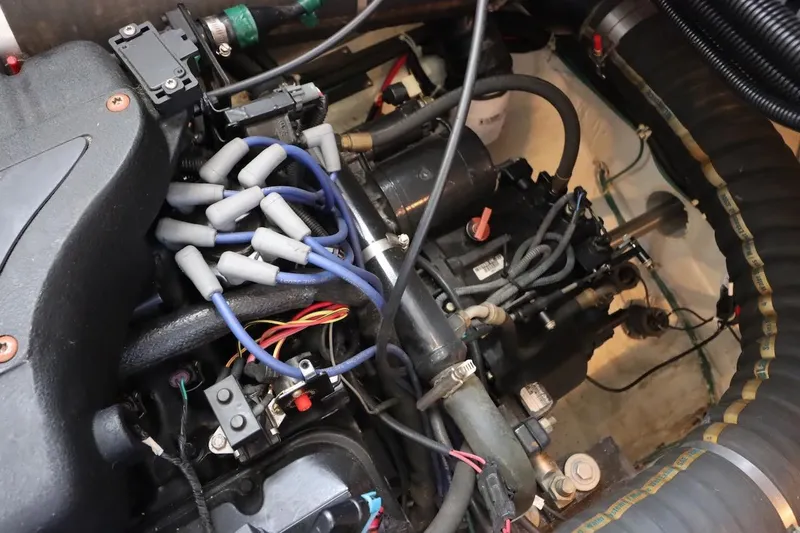 Grace Wins II Yacht Photos Pics Engine compartment of a 2001 Carver 406 Motor Yacht with visible wiring and components.