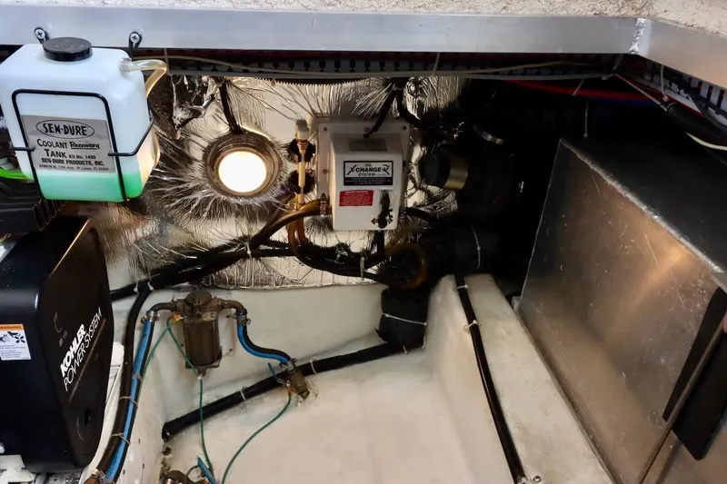 Grace Wins II Yacht Photos Pics Engine room of 2001 Carver 406 Motor Yacht with coolant recovery system.