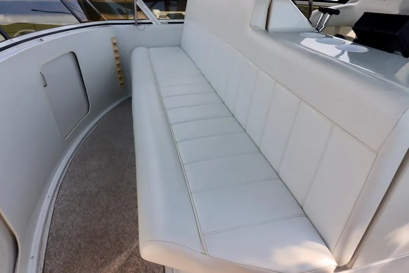 Grace Wins II Yacht Photos Pics Luxurious seating on 2001 Carver 406 Motor Yacht, featuring plush white upholstery.