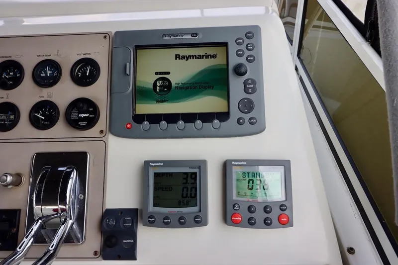 Grace Wins II Yacht Photos Pics Control panel of a 2001 Carver 406 Motor Yacht with Raymarine navigation displays.