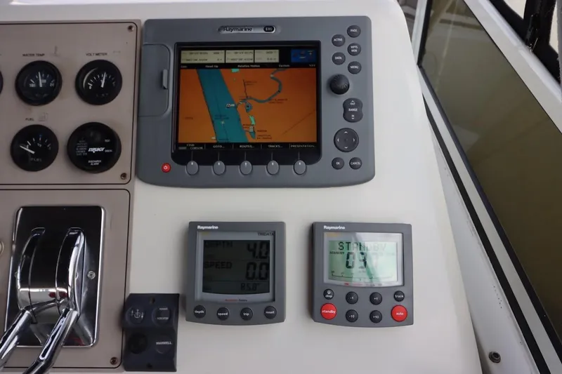 Grace Wins II Yacht Photos Pics Control panel of a 2001 Carver 406 Motor Yacht with navigation and gauges.