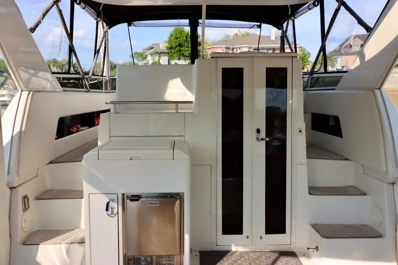 Grace Wins II Yacht Photos Pics 2001 Carver 406 Motor Yacht interior with stairs, storage, and glass doors.