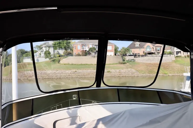 Grace Wins II Yacht Photos Pics View from 2001 Carver 406 Motor Yacht, overlooking waterfront homes and canal.