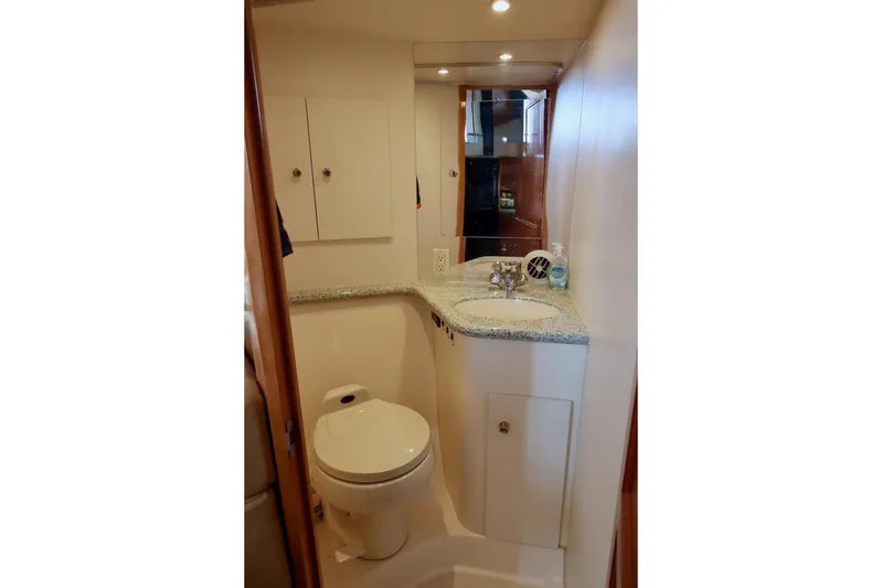 Grace Wins II Yacht Photos Pics Bathroom interior of 2001 Carver 406 Motor Yacht with sink and toilet.