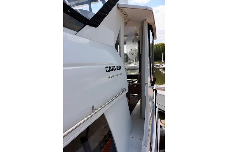 Grace Wins II Yacht Photos Pics 2001 Carver 406 Motor Yacht docked, showcasing sleek design and spacious interior.