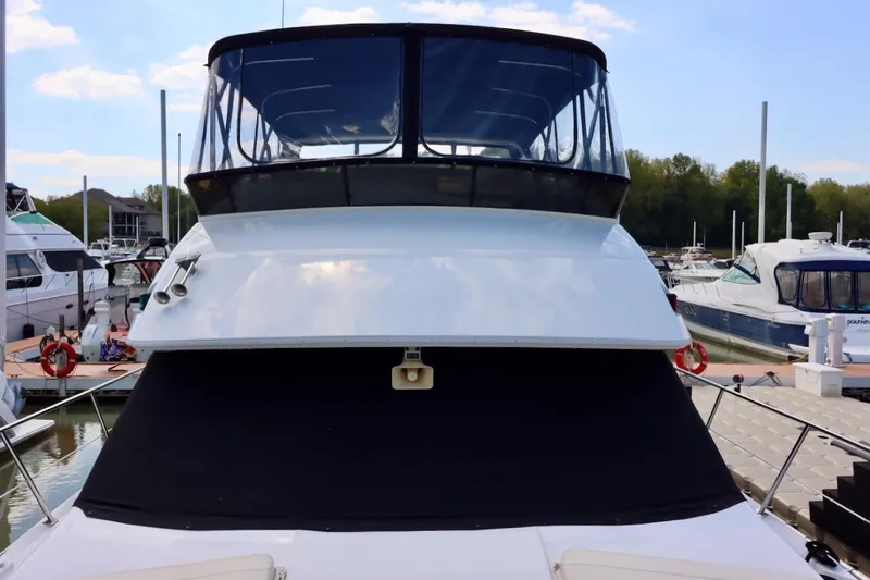 Grace Wins II Yacht Photos Pics 2001 Carver 406 Motor Yacht docked at marina, featuring sleek design and spacious deck.