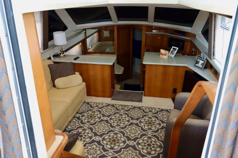 Grace Wins II Yacht Photos Pics Interior of 2001 Carver 406 Motor Yacht with cozy seating and elegant decor.