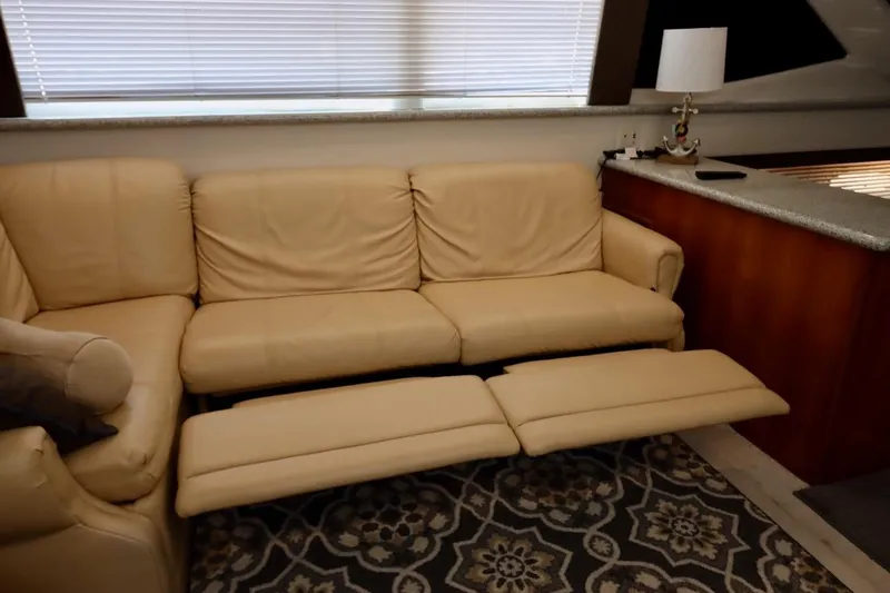 Grace Wins II Yacht Photos Pics Luxurious beige leather sofa in 2001 Carver 406 Motor Yacht interior.