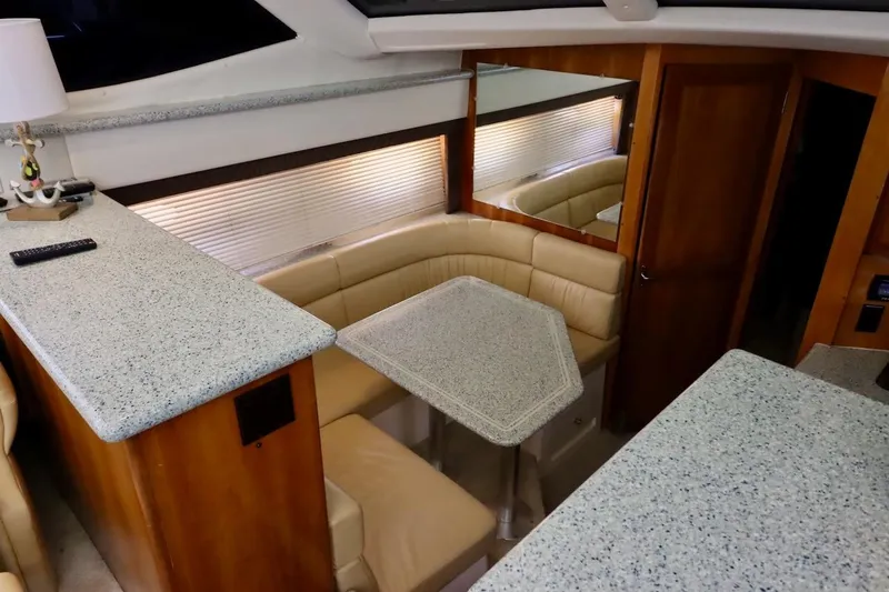 Grace Wins II Yacht Photos Pics Interior of 2001 Carver 406 Motor Yacht with cozy seating and elegant decor.