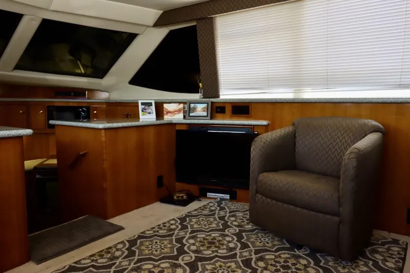 Grace Wins II Yacht Photos Pics Interior of 2001 Carver 406 Motor Yacht with cozy seating and elegant decor.