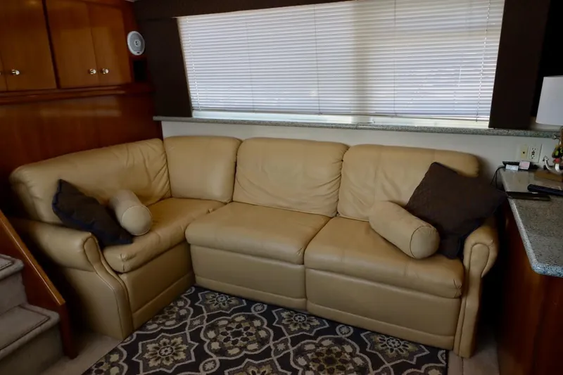 Grace Wins II Yacht Photos Pics Luxurious beige leather sofa in 2001 Carver 406 Motor Yacht interior.
