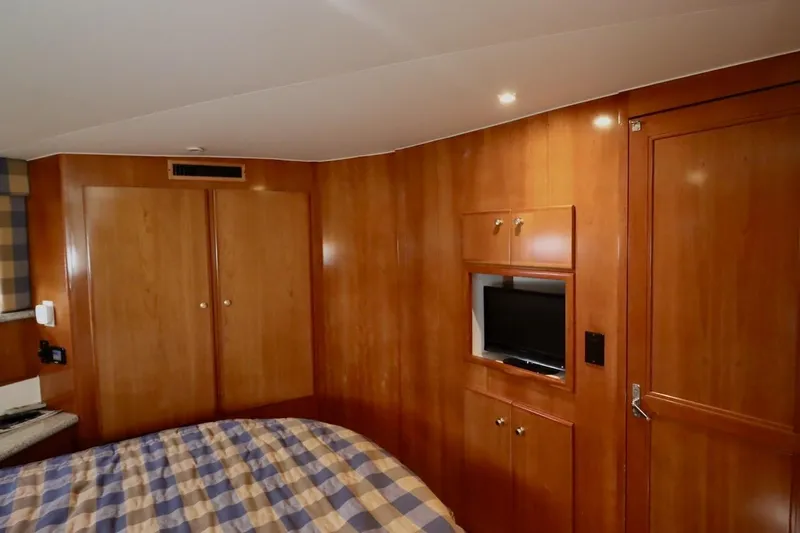Grace Wins II Yacht Photos Pics Interior of 2001 Carver 406 Motor Yacht with wood paneling and built-in TV.