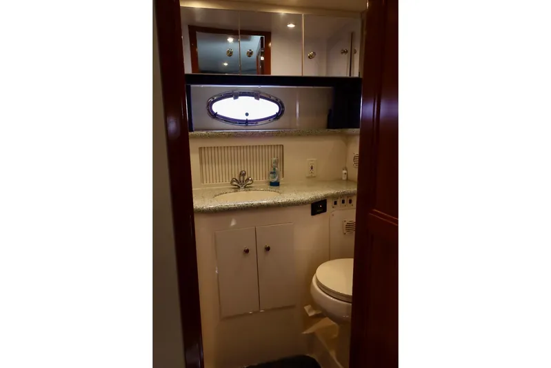 Grace Wins II Yacht Photos Pics Bathroom interior of 2001 Carver 406 Motor Yacht with sink and toilet.