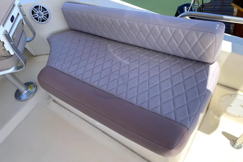 Hellion Yacht Photos Pics 2005 Mainship 34 Trawler interior with quilted seating and speaker detail.