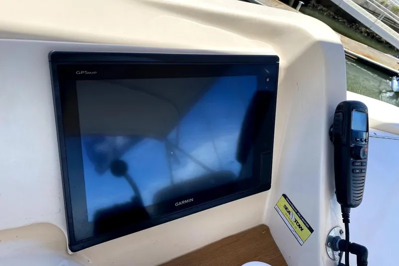 Hellion Yacht Photos Pics Garmin GPS and radio on 2005 Mainship 34 Trawler dashboard.