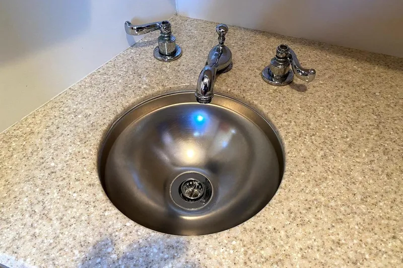 Hellion Yacht Photos Pics Stainless steel sink with chrome fixtures on a Mainship 34 Trawler, 2005 model.