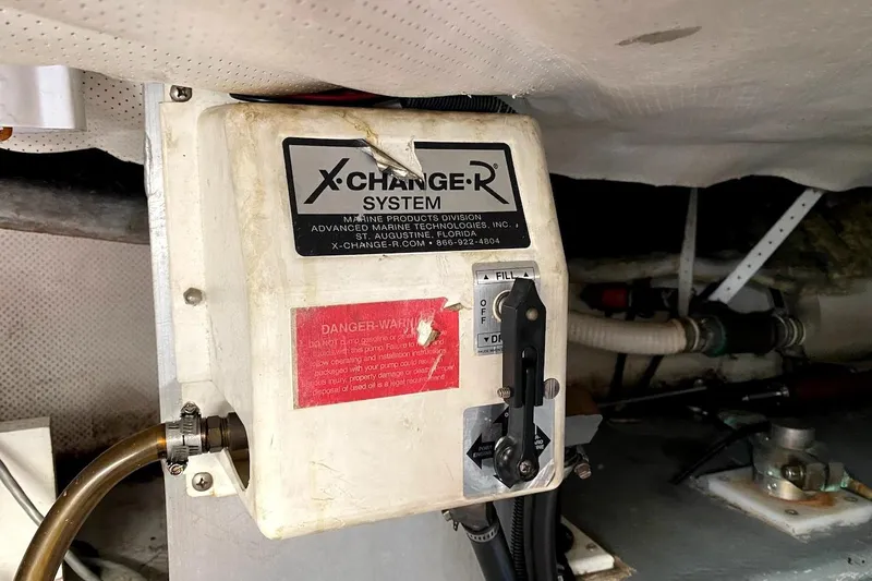 Hellion Yacht Photos Pics X-Change-R system in 2005 Mainship 34 Trawler engine room, showing control panel and hoses.