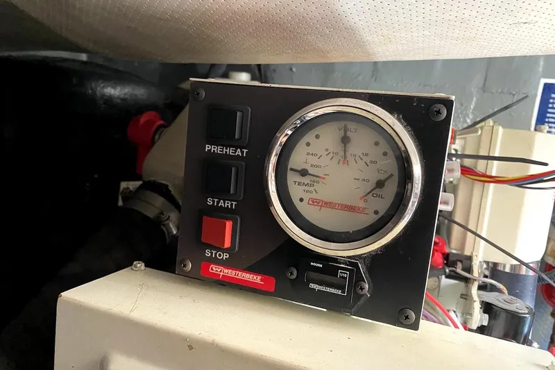 Hellion Yacht Photos Pics Control panel of a 2005 Mainship 34 Trawler with gauges and buttons.