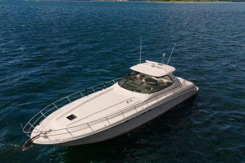  Yacht Photos Pics 1998 Sea Ray 540 Sundancer yacht cruising on open water.