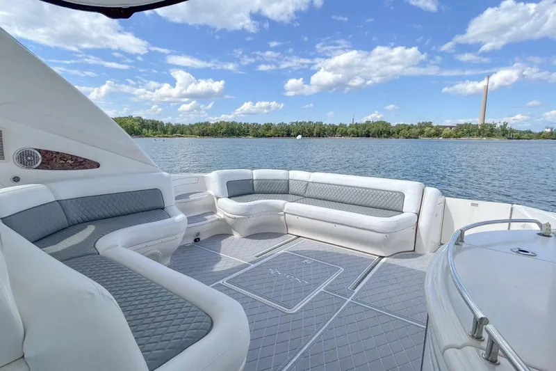  Yacht Photos Pics 1998 Sea Ray 540 Sundancer yacht with spacious seating, scenic water view, and clear blue sky.