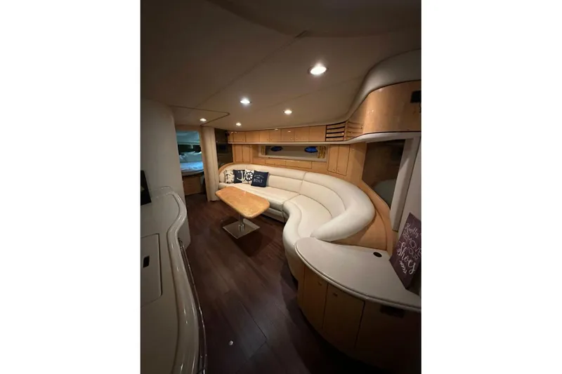  Yacht Photos Pics Luxurious interior of 1998 Sea Ray 540 Sundancer yacht with elegant seating and wood finishes.