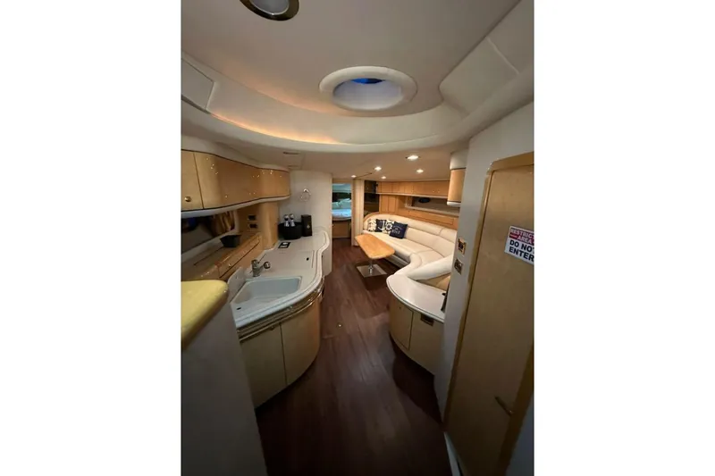  Yacht Photos Pics Luxurious interior of 1998 Sea Ray 540 Sundancer yacht with modern amenities and elegant design.