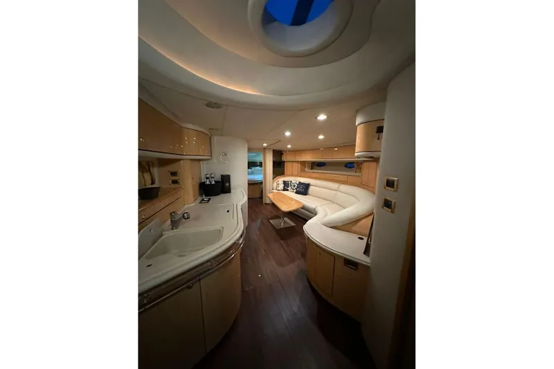 Yacht Photos Pics Luxurious interior of 1998 Sea Ray 540 Sundancer yacht with elegant seating and modern amenities.