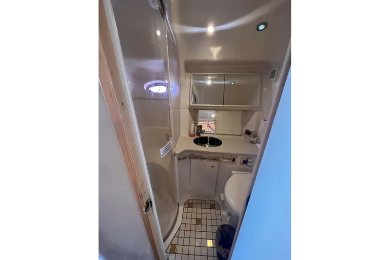  Yacht Photos Pics Bathroom interior of 1998 Sea Ray 540 Sundancer yacht, featuring shower and sink.