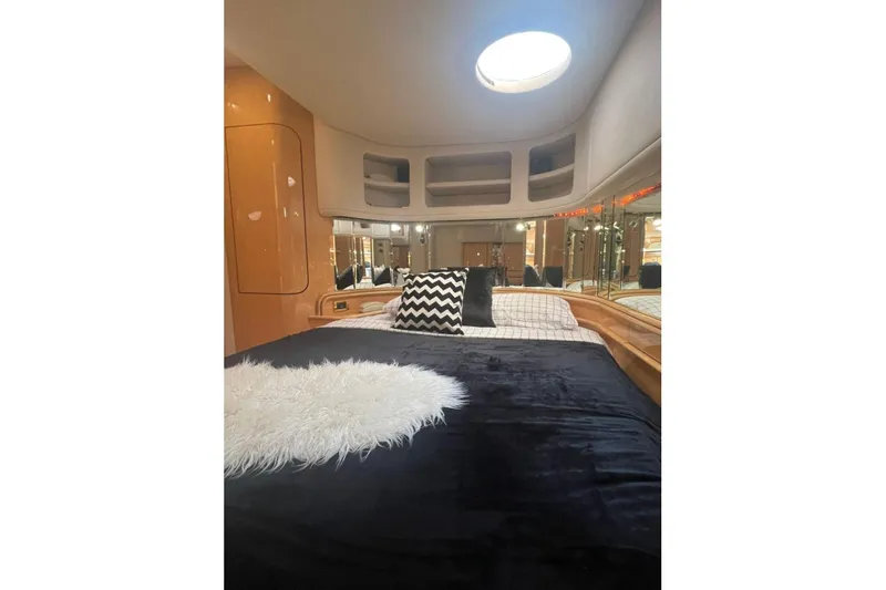  Yacht Photos Pics Luxurious cabin interior of 1998 Sea Ray 540 Sundancer yacht with plush bedding.