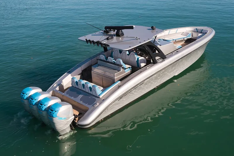  Yacht Photos Pics Luxury Midnight Express 43' Open boat with four powerful outboard engines on clear water.