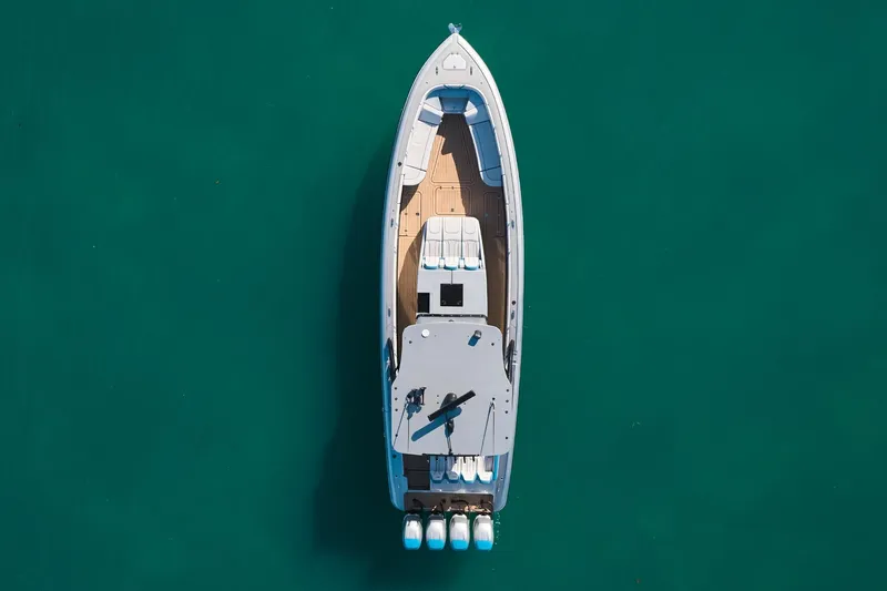  Yacht Photos Pics Aerial view of Midnight Express 43' Open boat on turquoise water.